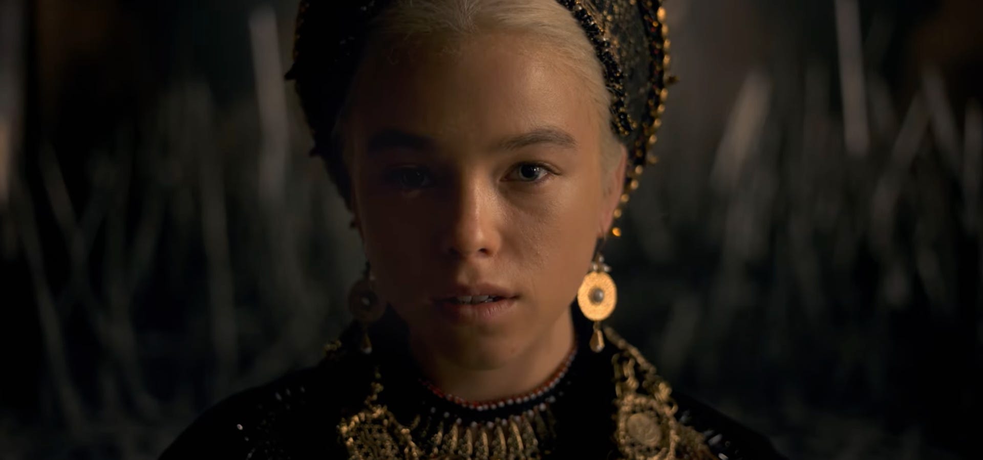 A closeup of Princess Rhaenyra Targaryen, staring directly into the camera