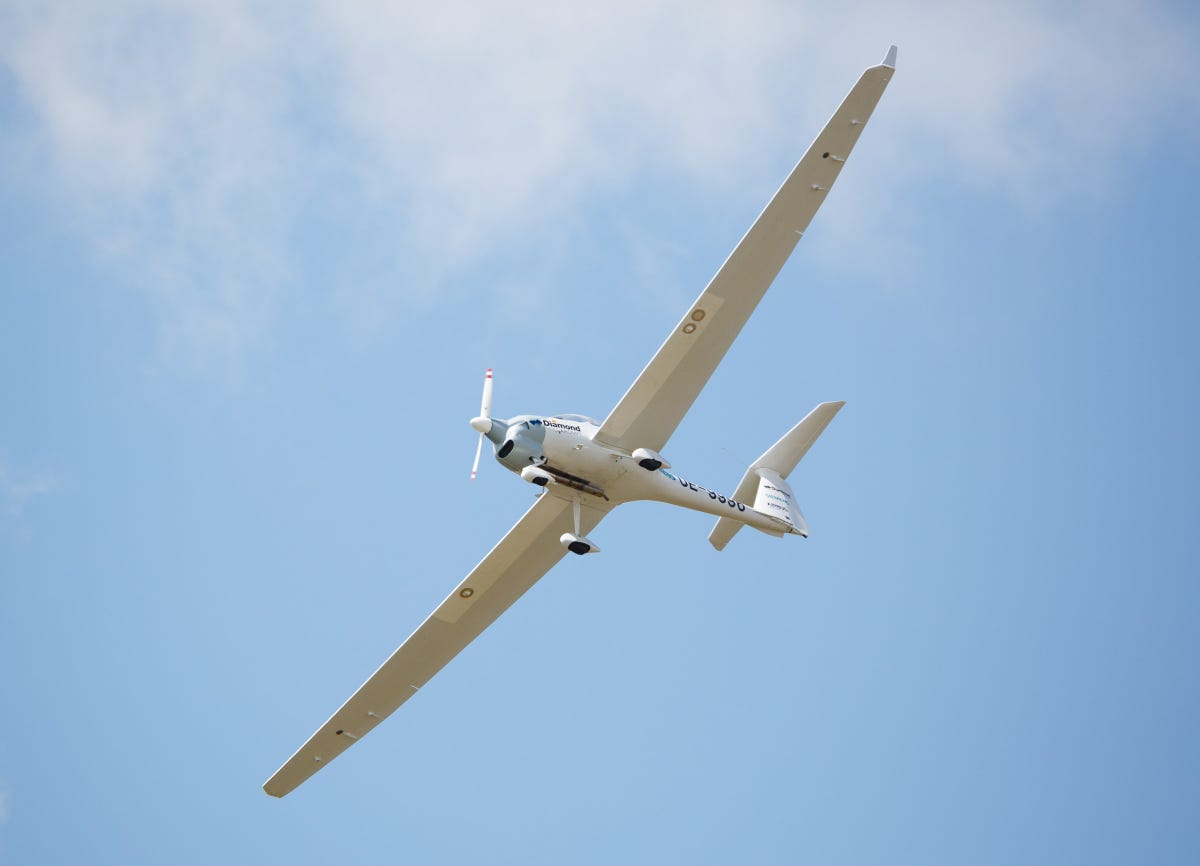 The DA36 E-Star 2, flying here above the Farnborough International Airshow, is a joint project with Airbus, Diamond Aircraft, and Siemens.