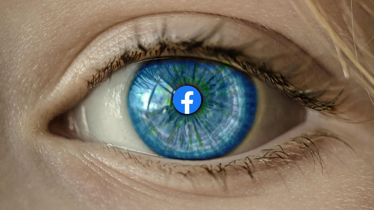 Human eye with a Facebook logo at the center of the pupil.
