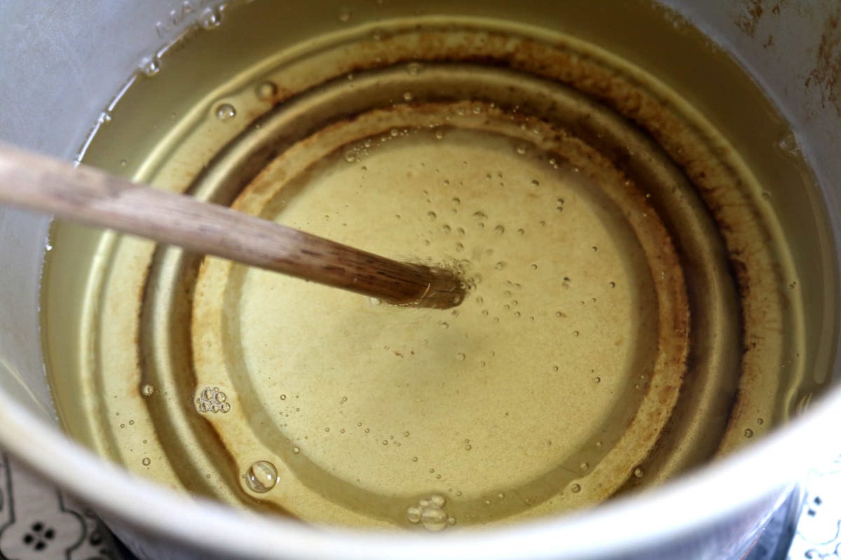 testing-oil-with-a-wooden-spoon.jpg