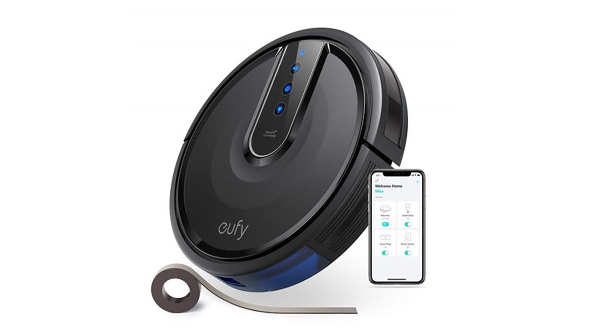 The Eufy RoboVac 35C is pictured along with the included boundary strip and a phone displaying the EufyHome app.
