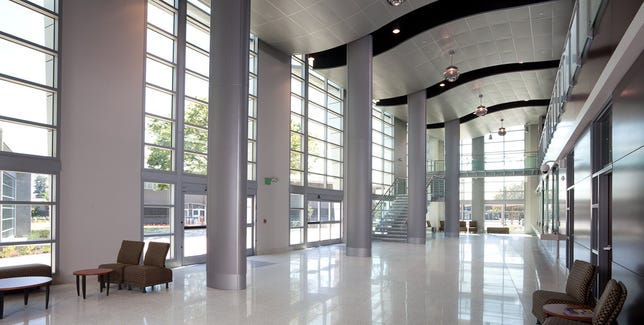 These two images show a building interior which uses Sage's electrochromic tinting glass.