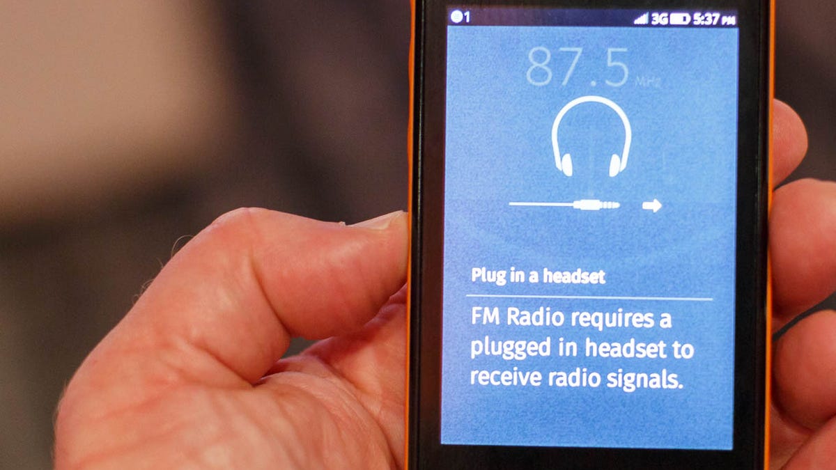 The Geeksphone Keon has an FM radio tuner app -- but it requires headphones to be used as an antenna.