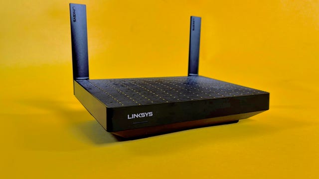 Linksys Hydra Pro 6 router on yellow background