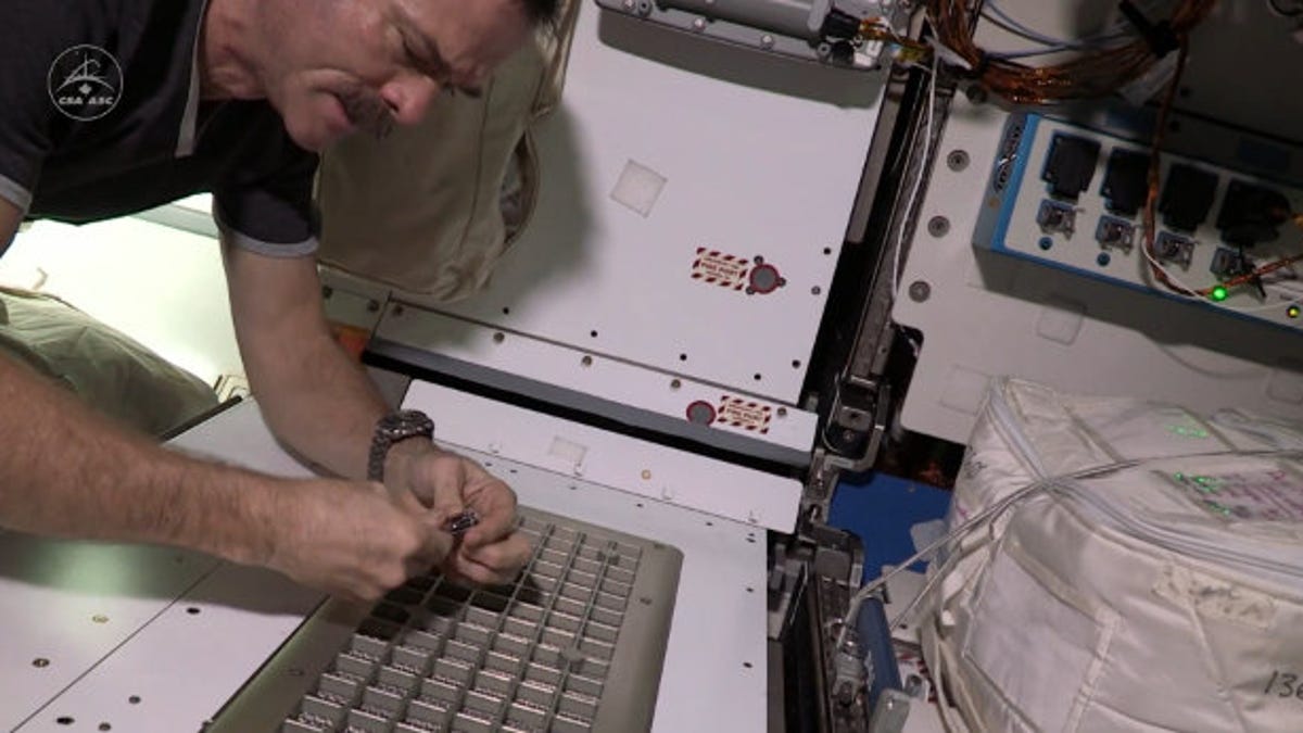 Astronaut Chris Hadfield clipping nails