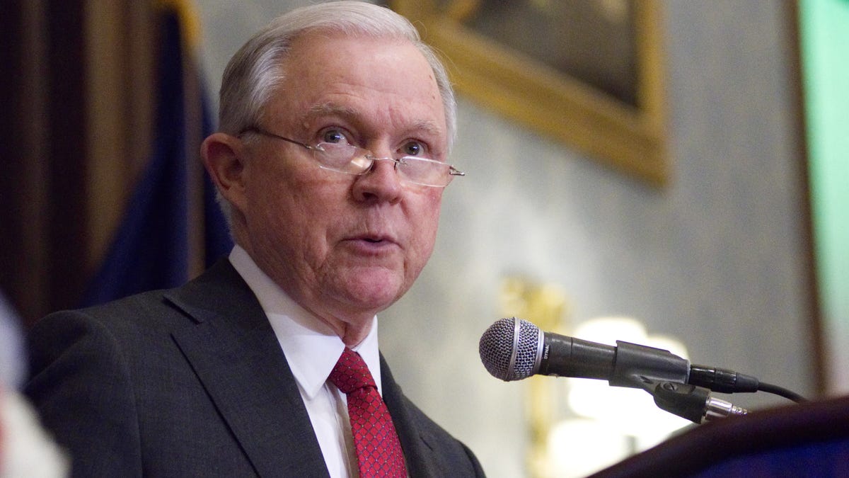 Attorney General Jeff Sessions stands at a podium. Sessions announced a cybersecurity task force composed of members from several government agencies and divisions of the Justice Department Tuesday. Their focus will be the abuse of technology.