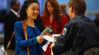 Woman at airport checking ID