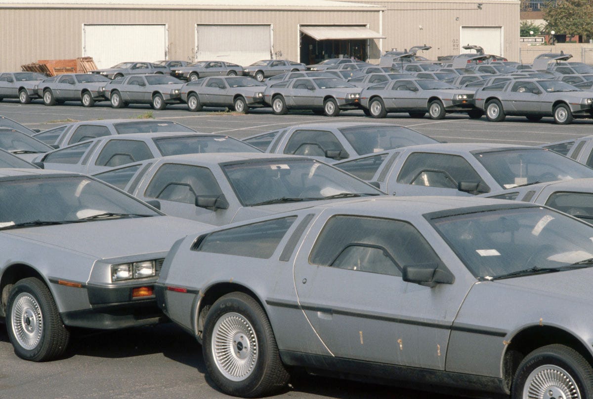 A yard full of gray DeLorean cars