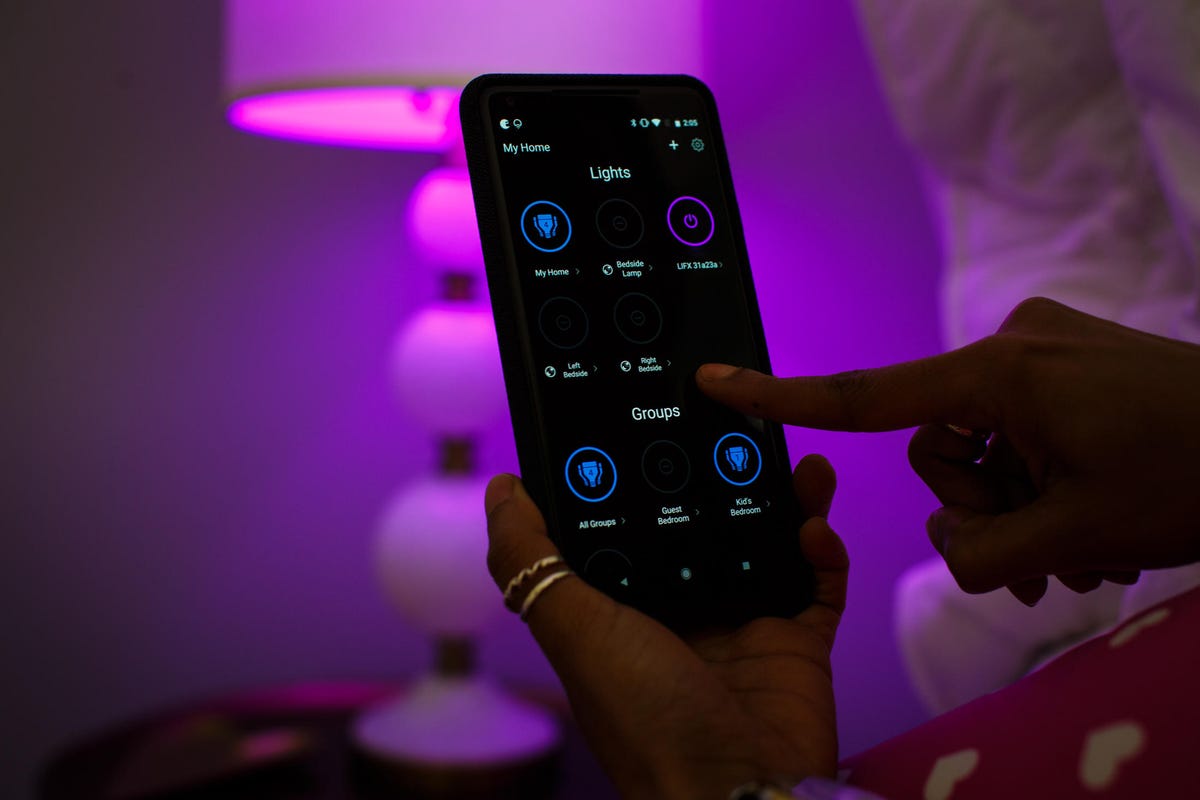 hand holding smart home remote
