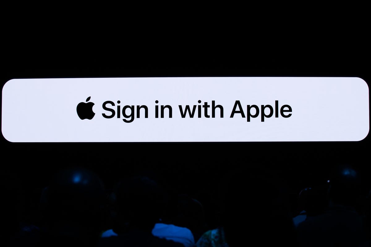 The Apple logo and the words Sign in with Apple.