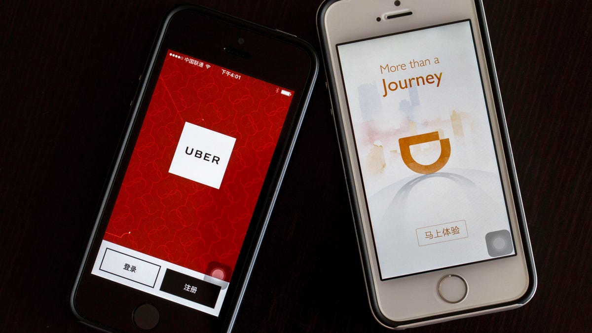 Apps of Uber and Didi Chuxing on smart phone.  Uber is