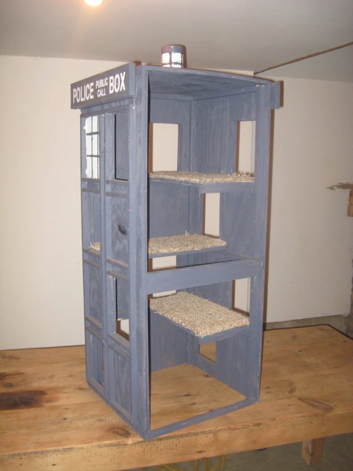 This "Doctor Who" Tardis cat condo may not be bigger on the inside than the outside, but it does have three levels.