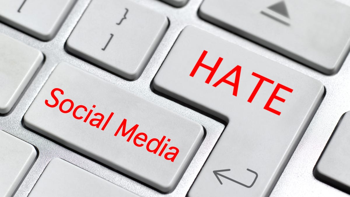 A portion of a computer keyboard with a key labeled HATE and another labeled Social Media