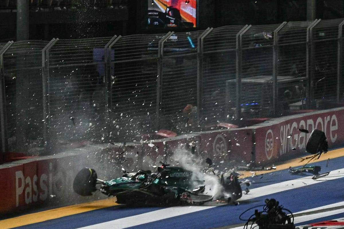 Aston Martin's Lance Stroll crashes during the qualifying session of the Singapore Formula One Grand Prix night race at the Marina Bay Street Circuit in Singapore