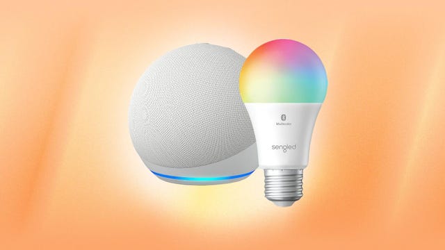 A white Echo Dot and a multicolor bulb on an orange background