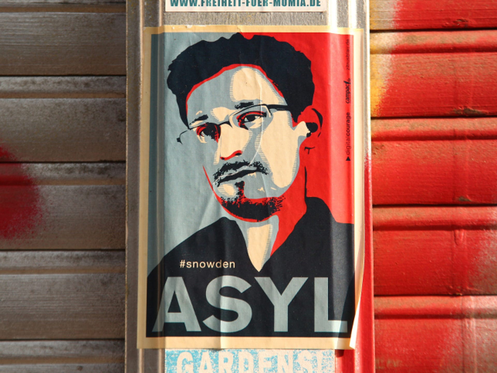 ​A sticker in Berlin, demanding asylum for Edward Snowden. The European Parliament has passed a symbolic resolution saying the NSA leaker should be protected from extradition to the US.