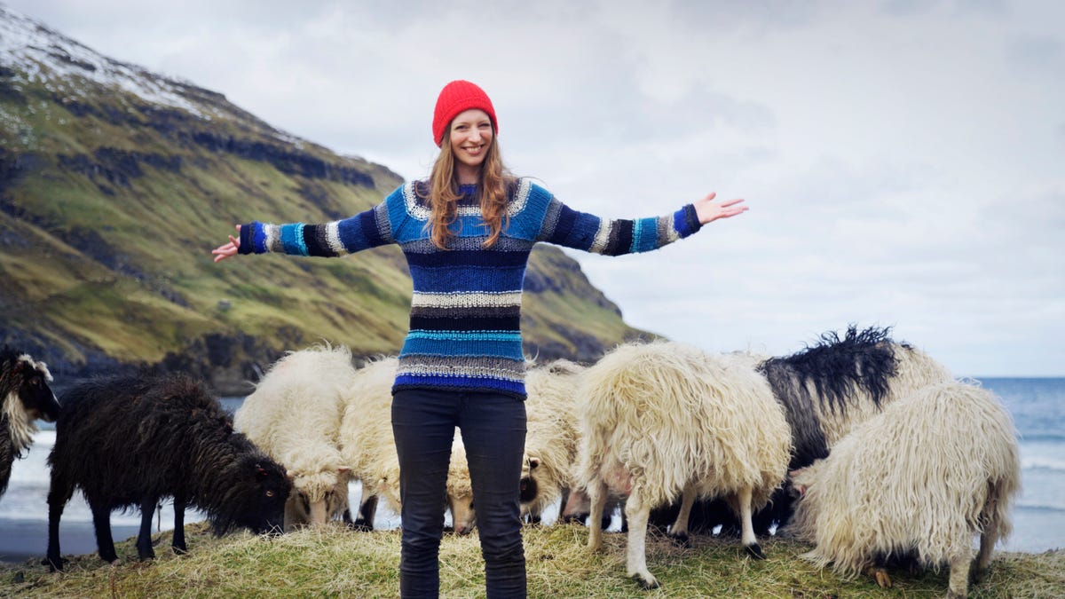 Bobble-hatted Faroe Islander Durita Dahl Andreassen and her flock of woolly photographers.