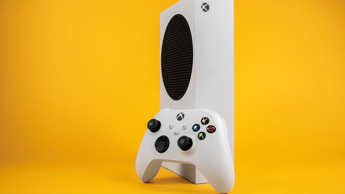 A white Xbox Series S and controller against a yellow background.