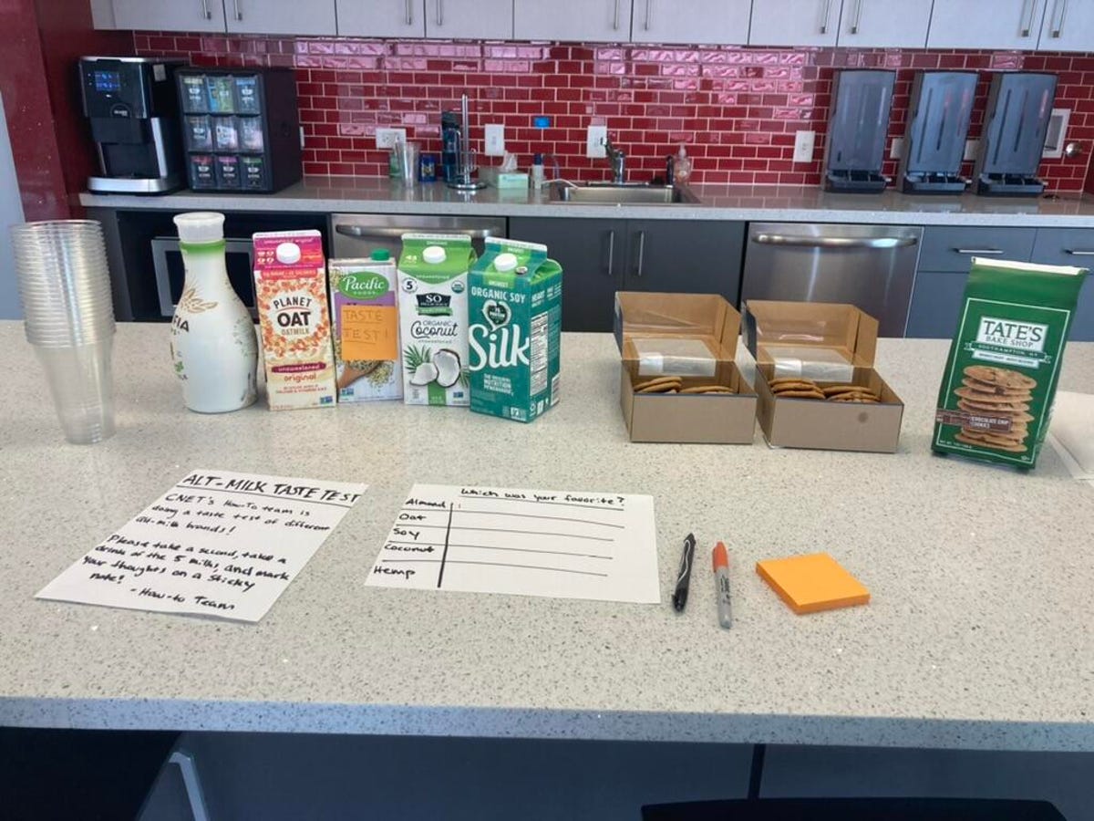 Glasses, plant milk cartons and cookies used for a taste test.