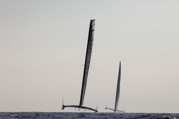 The Alinghi catamaran, left, and the BMW Oracle trimaran during the second race.