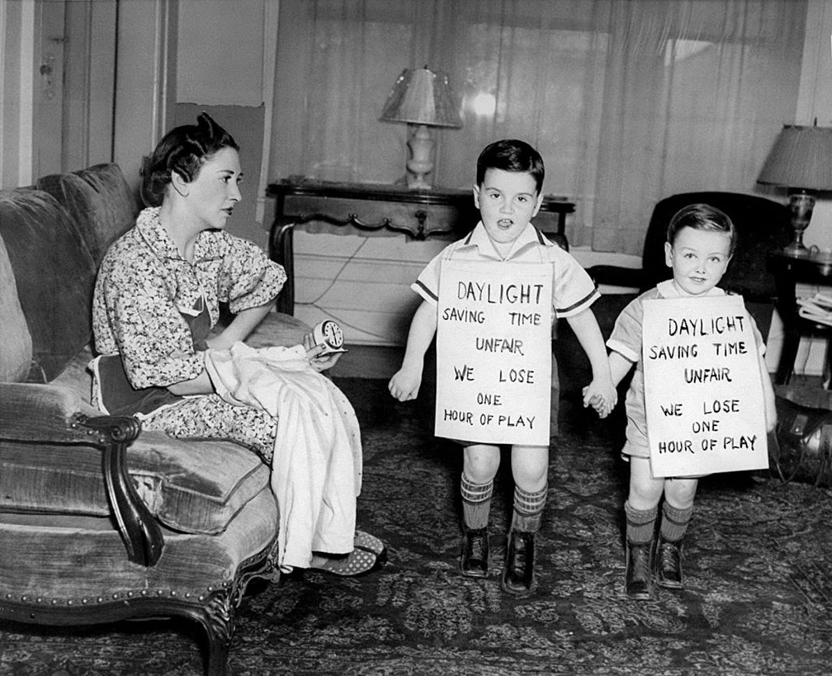 Mother with children protesting daylight saving time