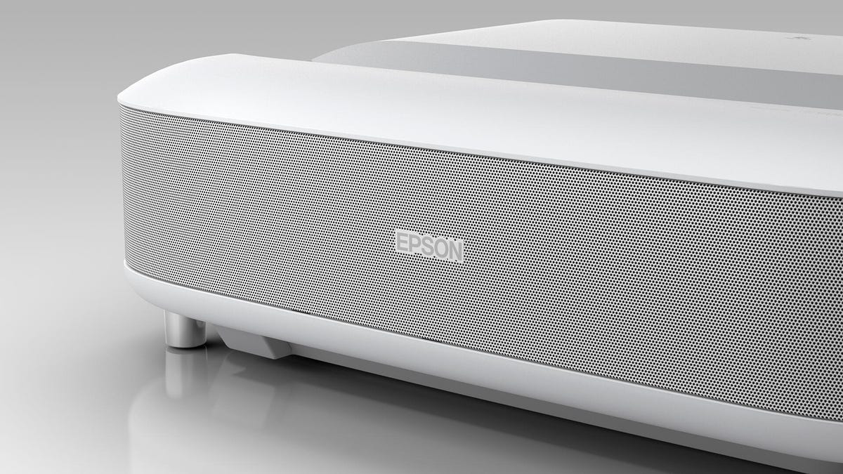 The front corner of the Epson LS650 UST projector in white.