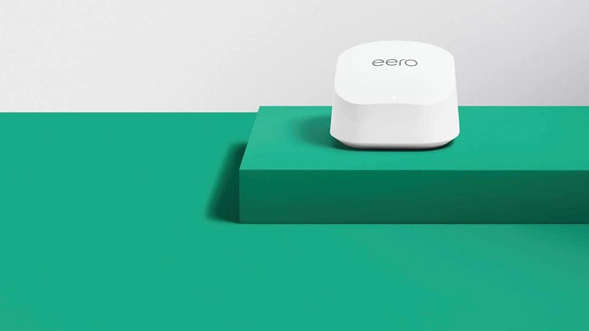 A white Eero 6 router on a green counter.