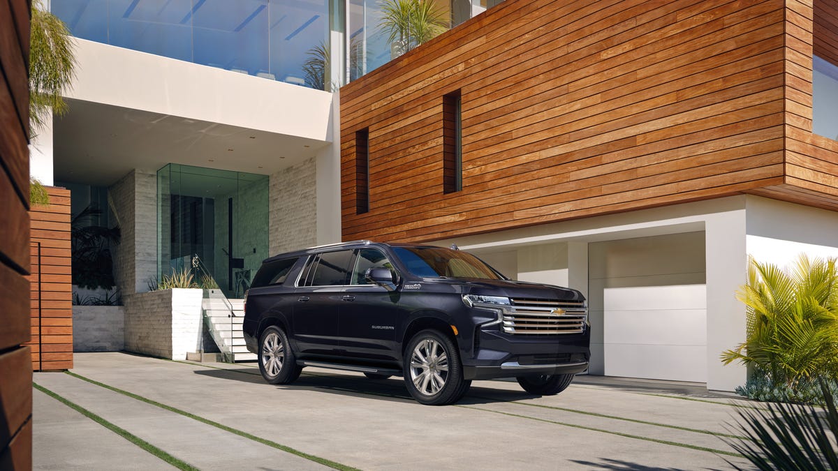 SUV parked in front of a modern house