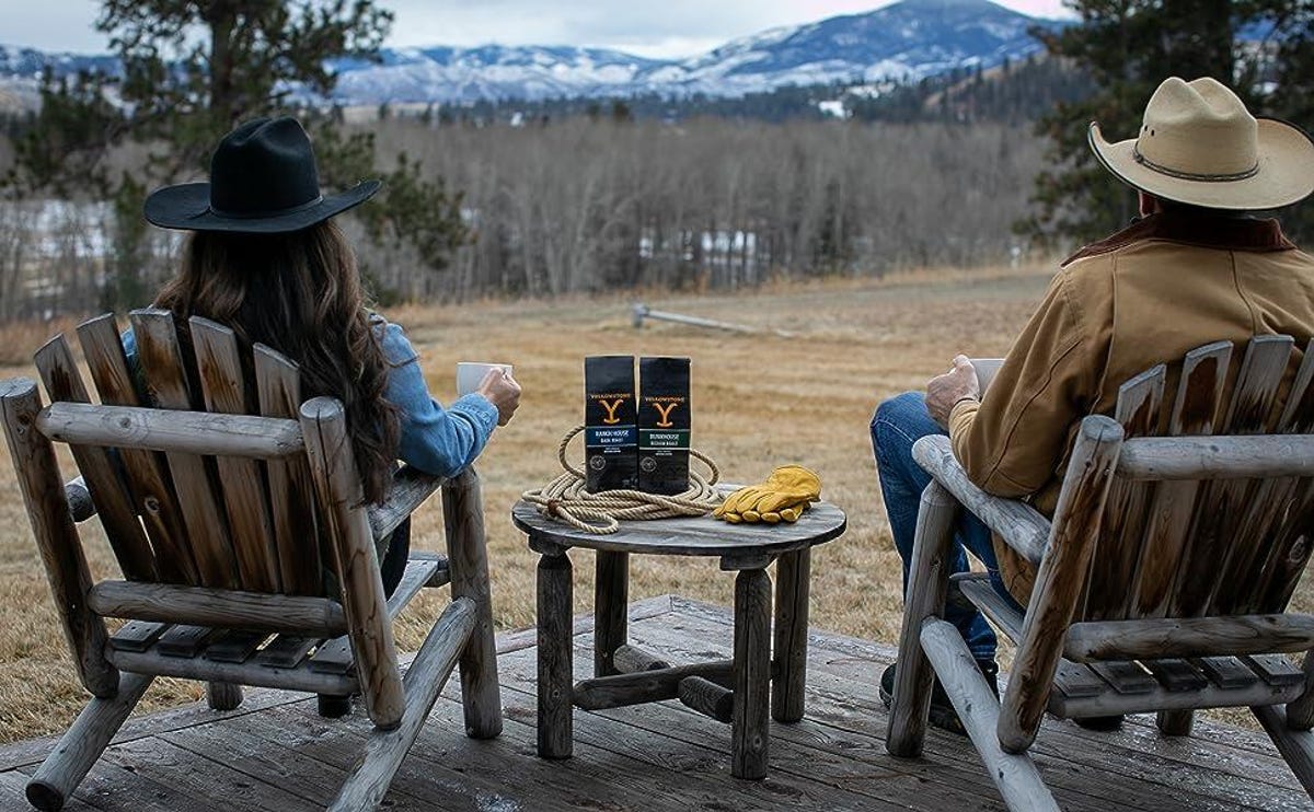 Couple wih bags of Yellowstone Bunkhouse coffee