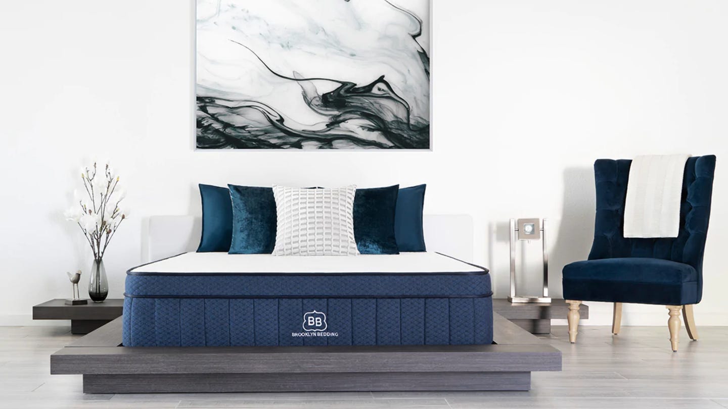 The Brooklyn Bedding Aurora mattress in a staged, decorated bedroom.