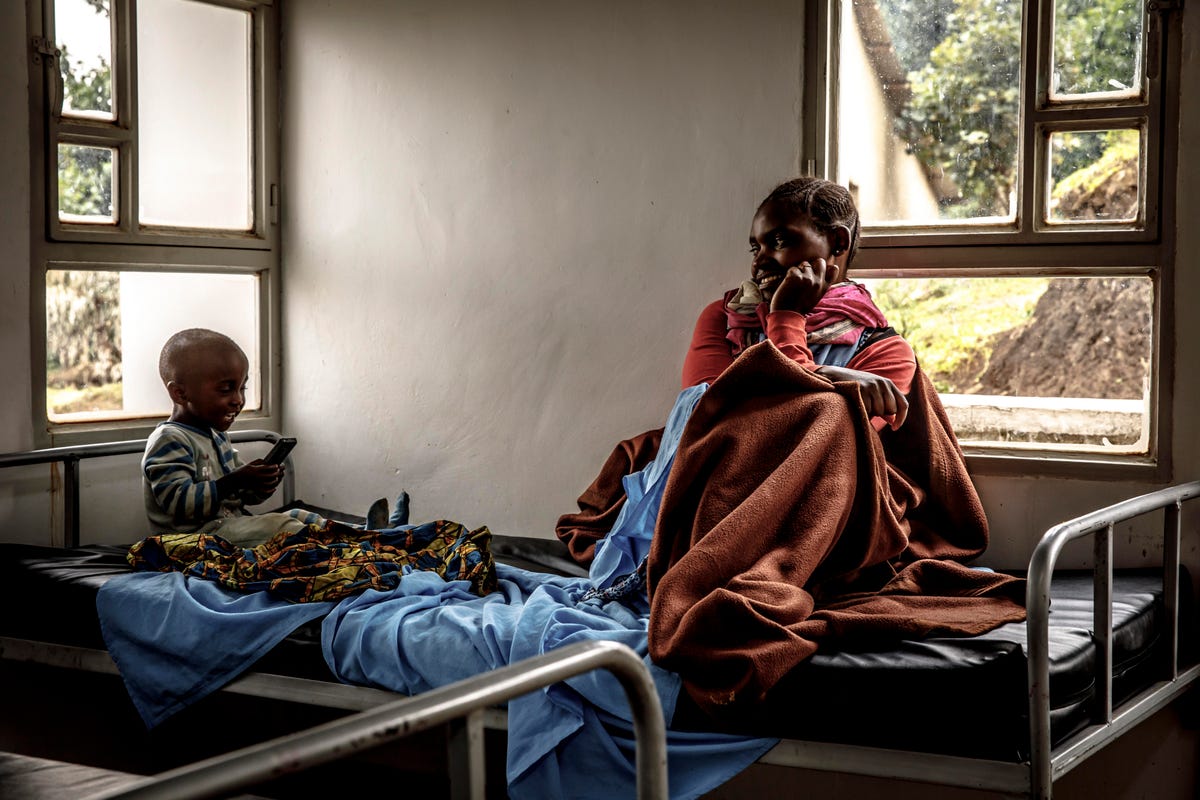 A boy and his mother in the hospital in Kintobo, Rwanda.