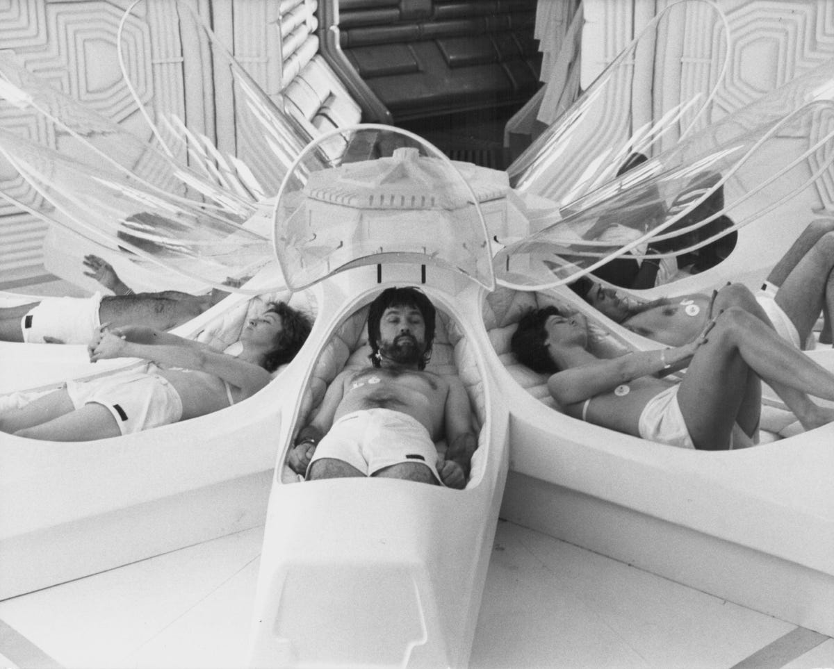 A scene from the movie Alien, in which the spaceship crew awakens from sleep pods.