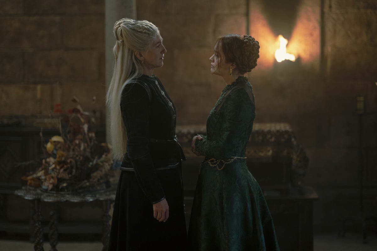 Princess Rhaenys and Queen Alicent face each other inside a large room