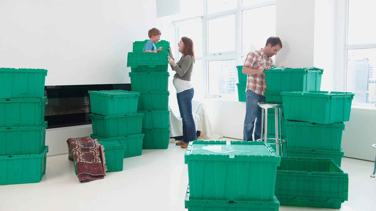 Family with plastic moving crates