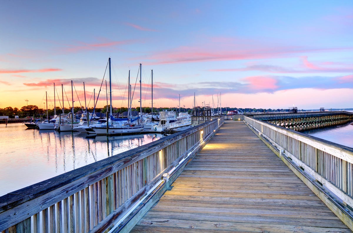 Waterfront boardwalk in Stamford, Connecticut, at sunset.