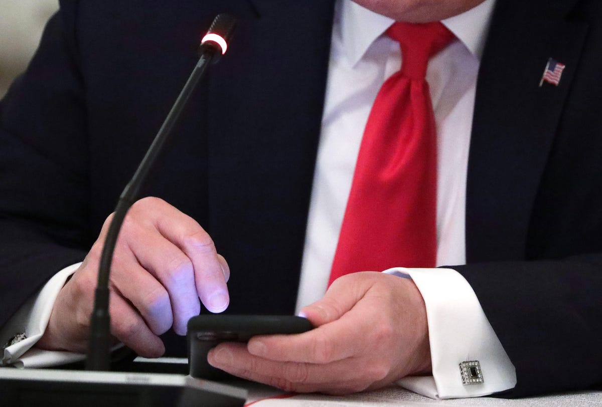 Donald Trump using a smartphone