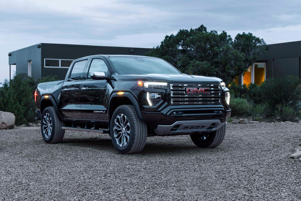2023 GMC Canyon Denali in black posing in front of a house