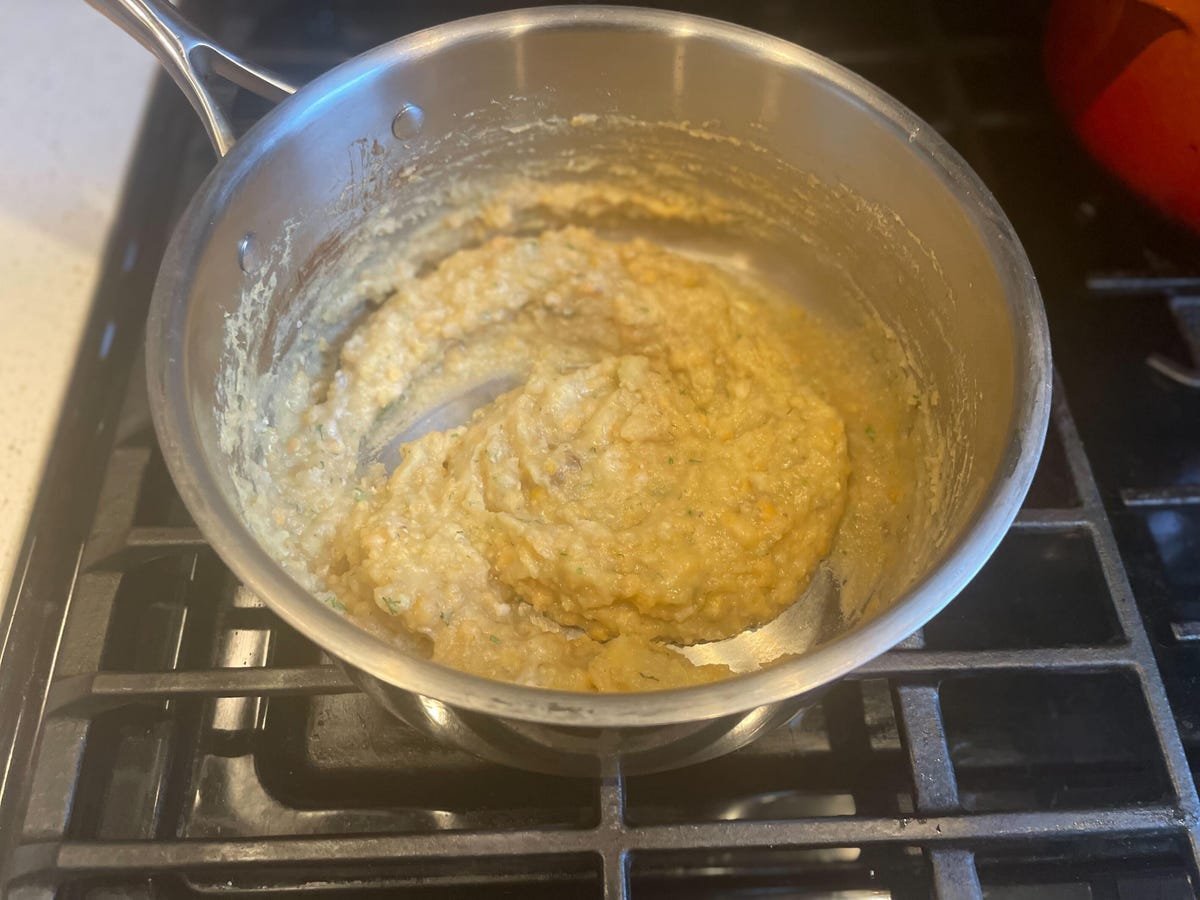 mashed lentil in pot on stove