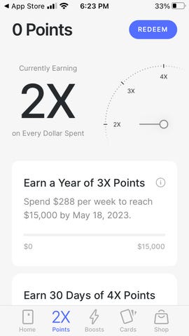 Екран в приложението X1 показва измерване на колко точки печелите в момента, както и колко трябва да харчите на седмица през следващата година, за да стигнете до следващото ниво.