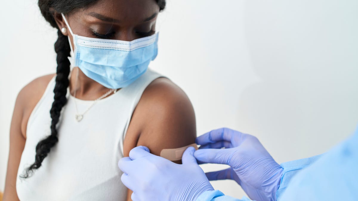 Young woman getting vaccinated