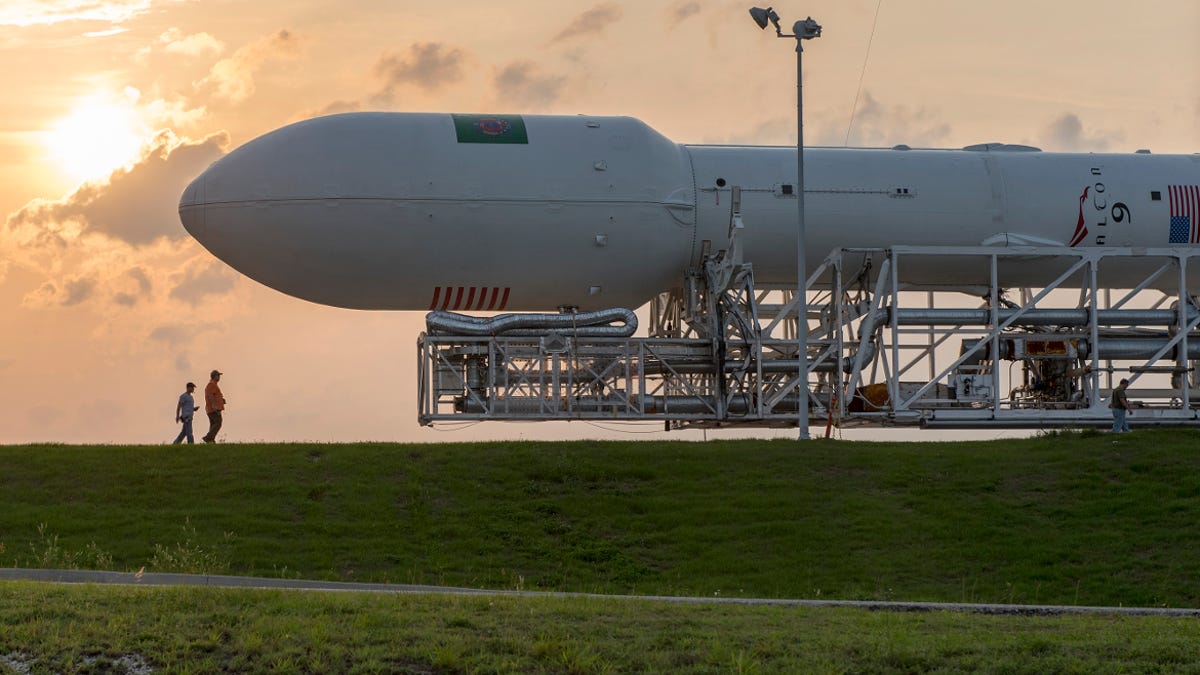 SpaceX&apos;s Falcon 9 rocket is moved to a launch pad before a launch attempt in 2015.