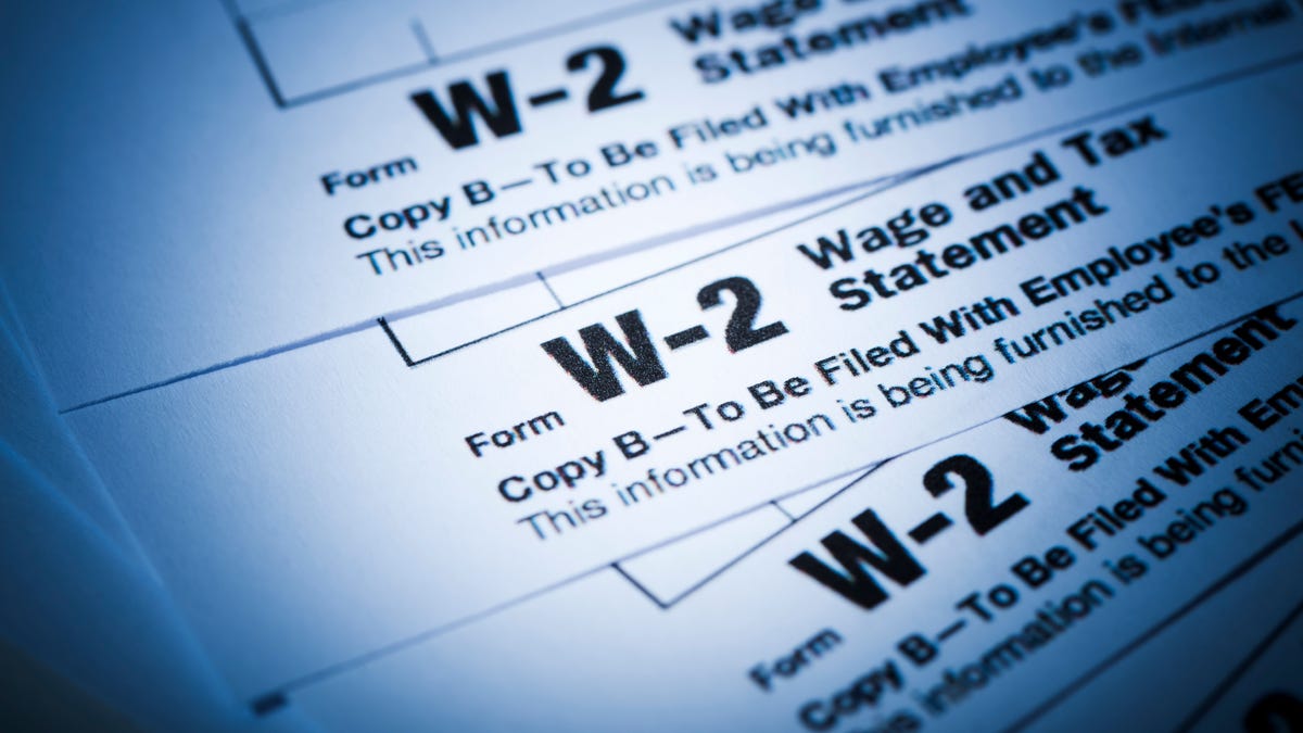 Three W-2 tax forms stacked on top of one another