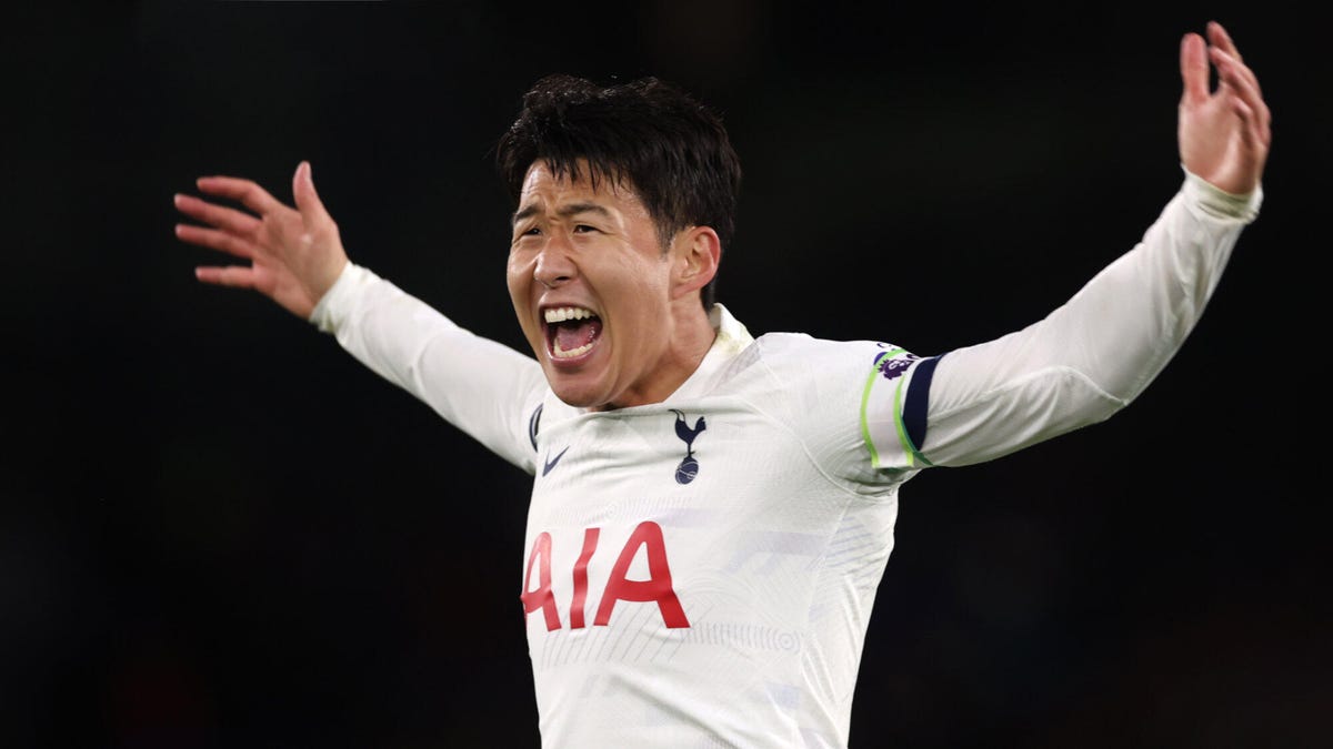 Tottenham Hotspur forward Son Heung-Min shouting, arms outstretched.