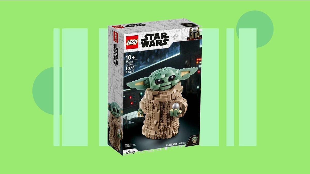 The box of the Baby Yoda Lego kit against a green background.
