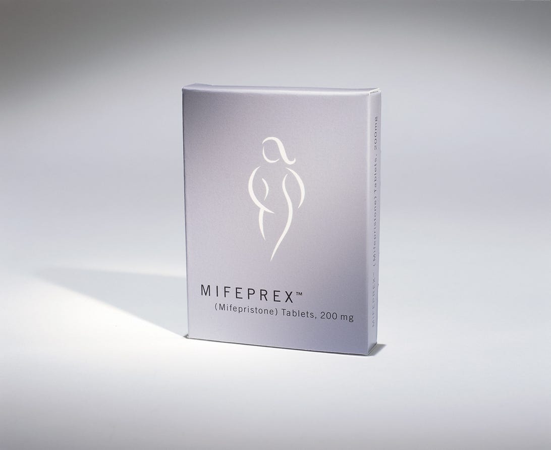 A box of Mifeprex with a sketched image of a woman.