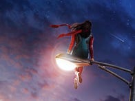 <p>A costumed Ms Marvel sits on a lamp post, gazing at a cloudy sky at sunset.</p>