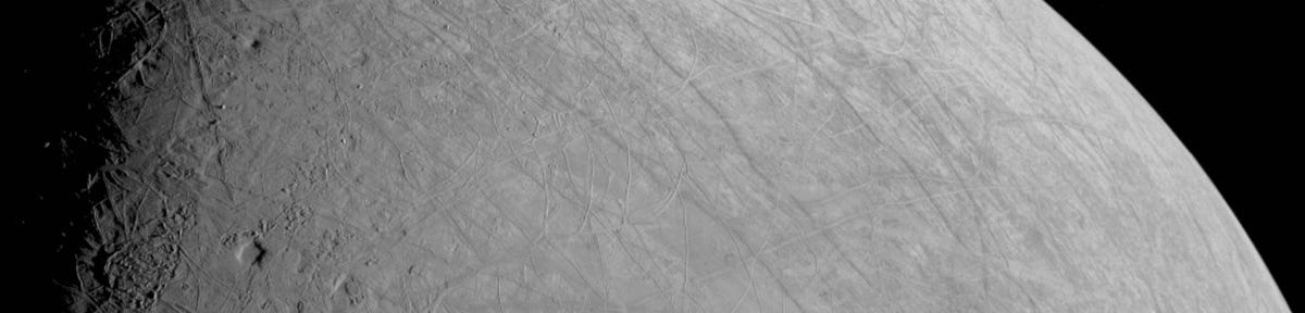 A black and white slice of icy Europa's striated surface.