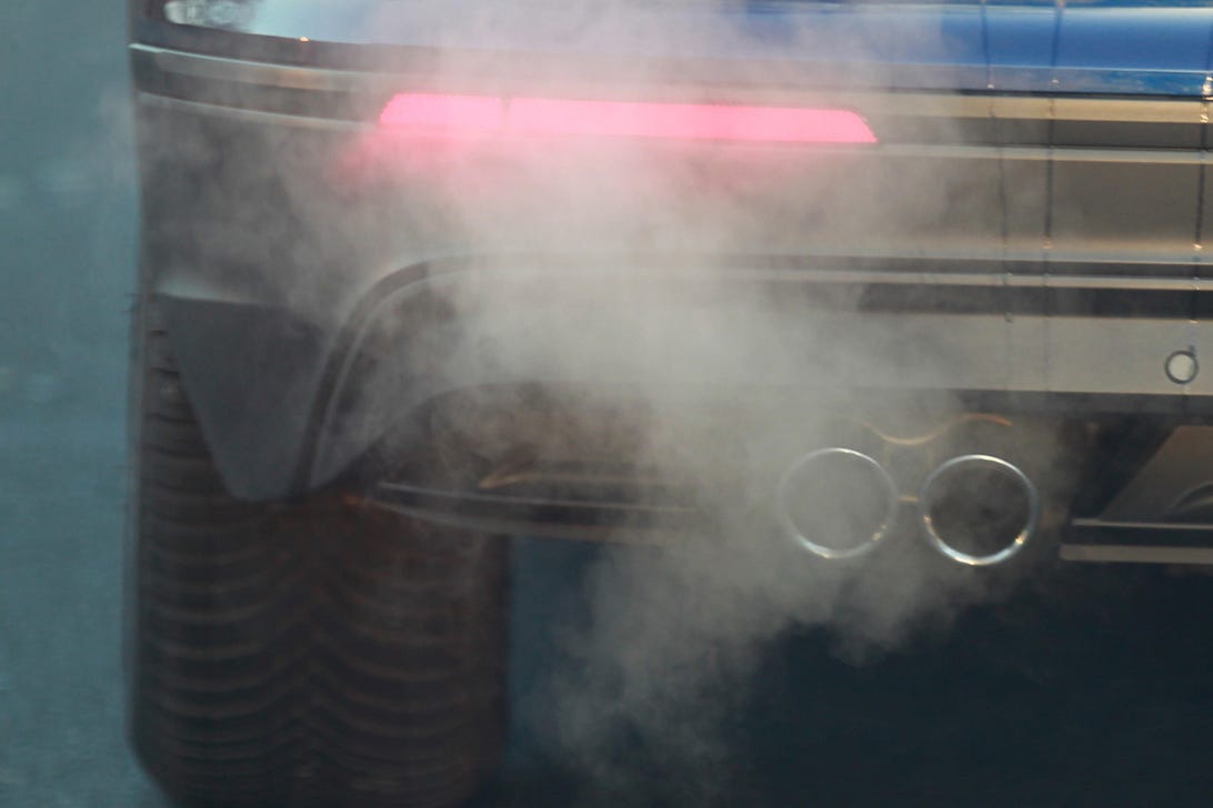 A car seen emitting exhaust fumes on the Street In Cologne.
