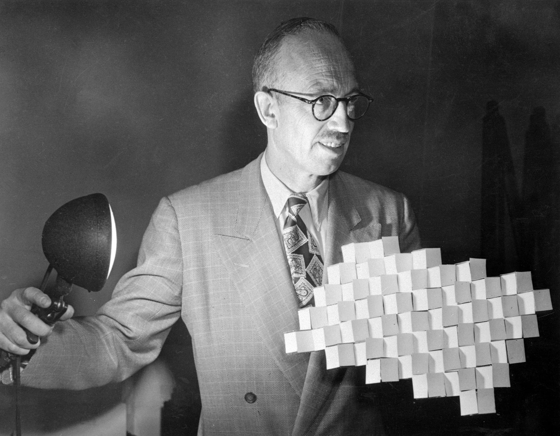 Herbert T. Kalmus Holding Lamp