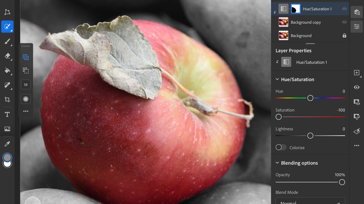 An image of an apple in Photoshop amid editing tool options